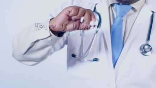 Doctor Writes "Health is Wealth" on Screen