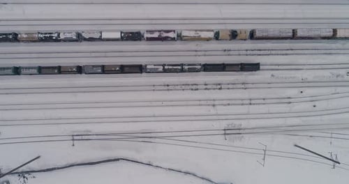 Railway station and the trains. Aerial. Winter, snow, cloudy 07