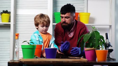 Dad and Child Planting Plants Together