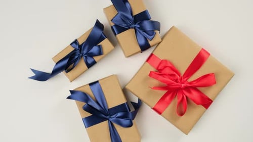 Wrapped Birthday Presents Arranged on White Table