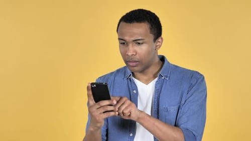 Man Shocked by News on Phone, Surprise Reaction