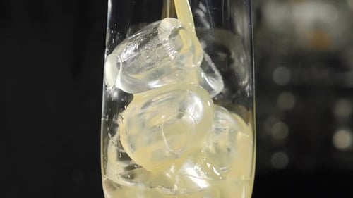 Pouring Juice on Ice Cubes
