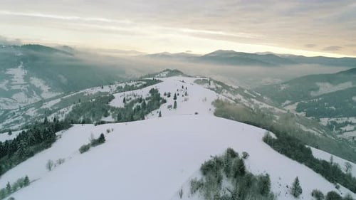 Aerial View in Foggy Sunset Winter Mountain