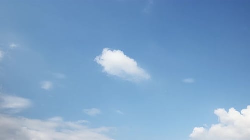 Beautiful Blue Sky with Drifting White Clouds