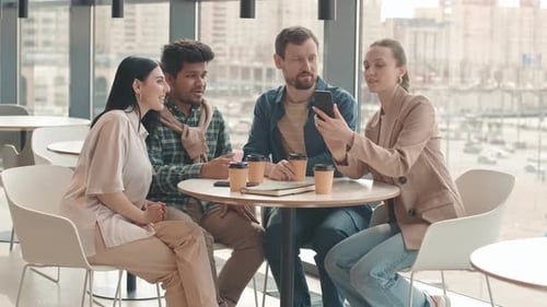 Friends Enjoying Coffee and Smartphone Indoors