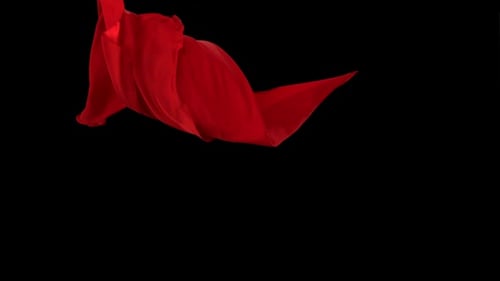 Roter Stoff fließt auf schwarzem Hintergrund, Zeitlupe
