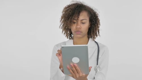 Female Doctor Using Tablet in Medical Setting