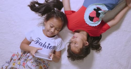Little Girls Playing With Tablet
