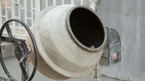 Rotating Cement Mixer Blending Components into Concrete