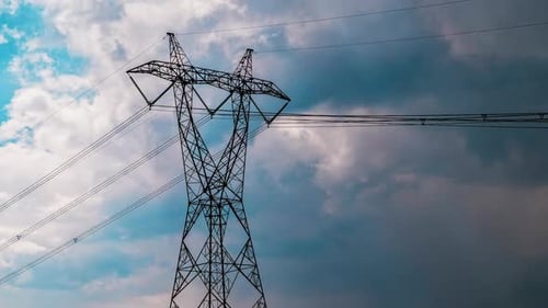 Electrical Tower with Dramatic Moving Storm Clouds