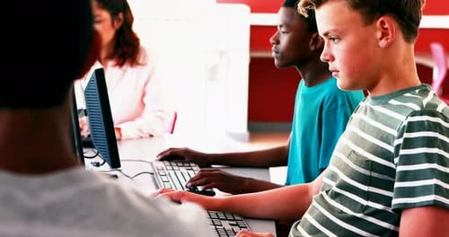 Students Working on Computers in School Classroom