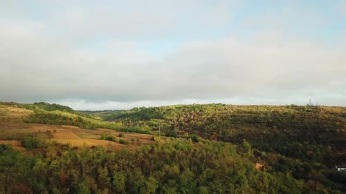 Beautiful landscape of rural place with brown meadows and fields.