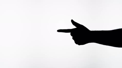 Silhouetted Hand Forming Gun Shape
