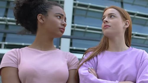 Upset Young Women with Arms Crossed After Argument