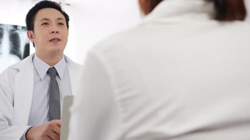 Doctor Consulting with Patient in Bright Office