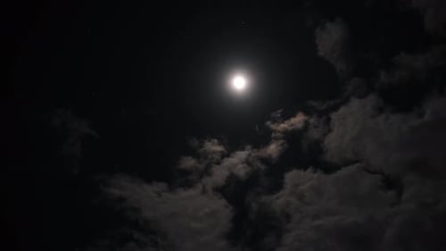 Clouds Passing the Moon at Night