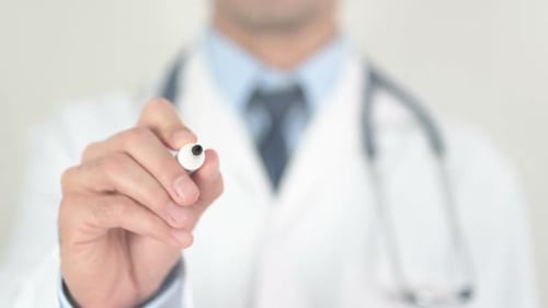 Medical Professional Writes the Word Health