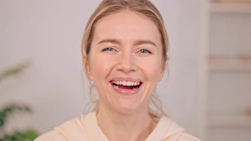 Smiling Female Face Indoor Front View