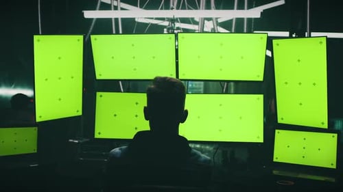 Male Hacker Creating Malware on Computers