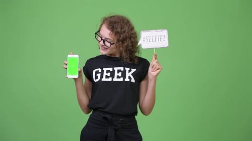 Teen Girl Holding Smartphone with Green Screen