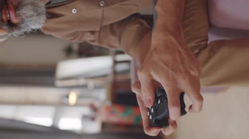 Close Up of Man Using Gamepad and Playing Console Game