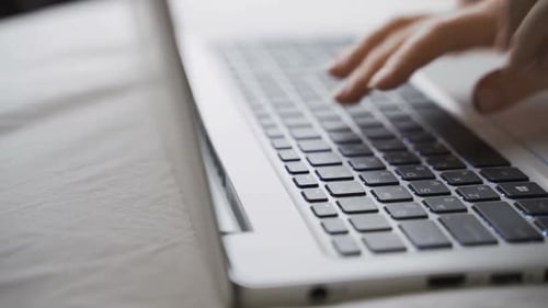 Closeup of Business Woman Hand Typing on Laptop Keyboard