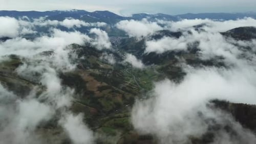 Aerial View of Mountains with Clouds and Hills