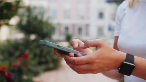 Close Up of Female Hands Holding Smartphone