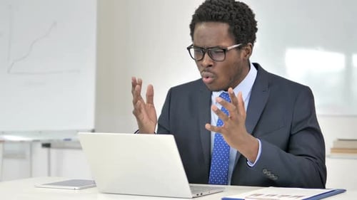 Businessman Frustrated at Computer in the Office