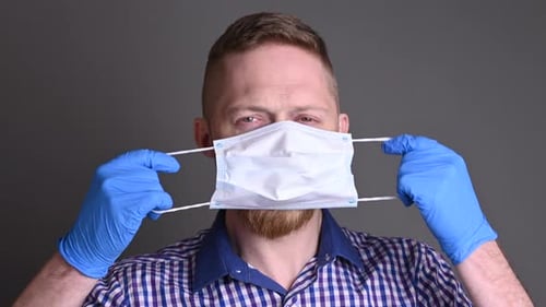 Man Wearing Face Mask and Blue Gloves