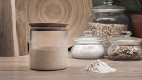 Bubbly Sourdough Starter in Glass Jar on Counter
