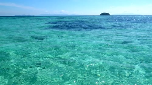 View From Boat to Crystal Clear Turquoise Sea Water with Coral Reef