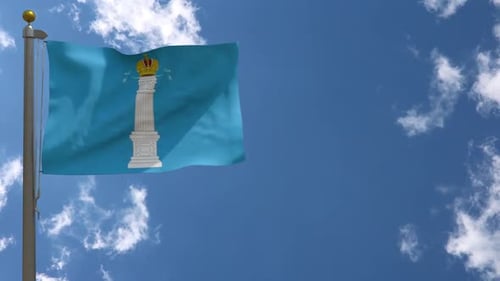 Flag Waving with Column and Crown Emblem against Blue Sky