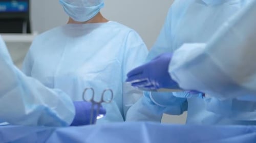Surgeons Performing Operation in Operating Room