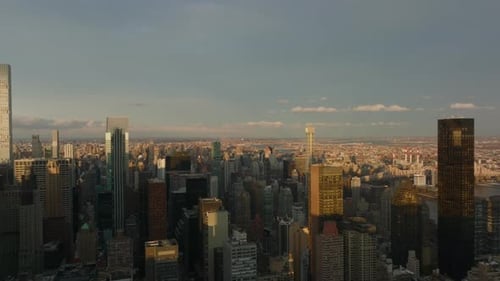 Forwards Fly Above Tall Apartment or Office Buildings