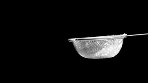 Powdered Flour Being Sifted Through Metal Sieve