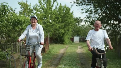 Family Relationships, Older Husband and Wife Loving Each Other Spend Time Together Riding Bicycles