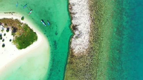 Beautiful coral reef and sandbank with tropical vegetation on Thailand. Aerial