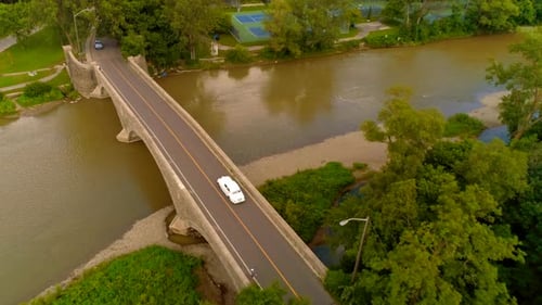 Aerial shot on an old classic Rolls Royce car on a bridge