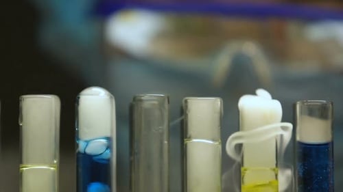 Laboratory Worker Adding Substance Into Test Tube, Monitoring Chemical Reaction