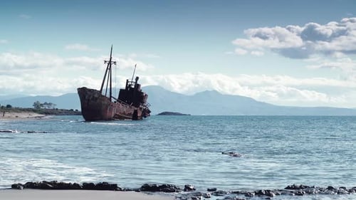 Rusty Broken Shipwreck On Sea Shore