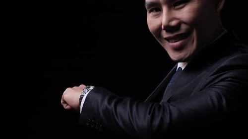 Business man looking smart watch