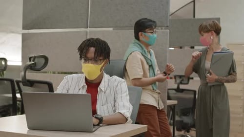 Workers Bumping Elbows Wearing Masks