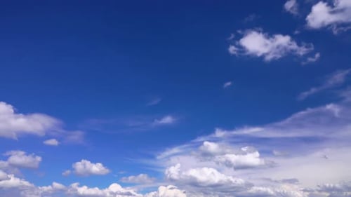 Fluffy White Clouds in a Clear Blue Sky