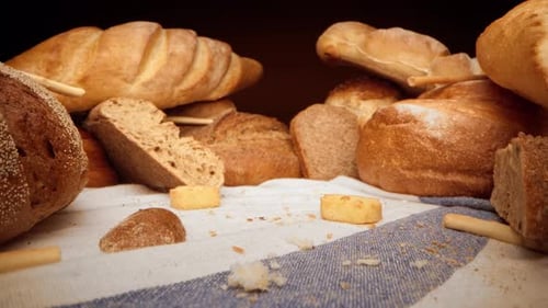 Assortment of Fresh Bread on Tablecloth Zoom in Video