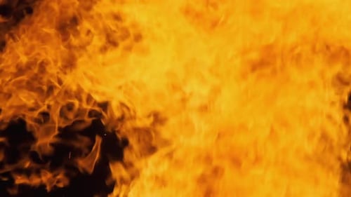 Close-Up of Dynamic Golden Flames on Black Background