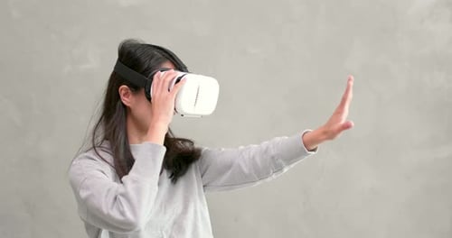 Smiling Woman Experiencing Virtual Reality Headset