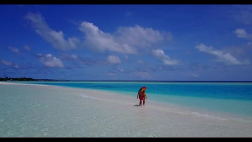 Boy and girl sunbathe on marine sea view beach adventure by aqua blue ocean and white sandy backgrou