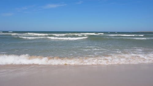 Beautiful Waves on the Shore of a Sandy Beach