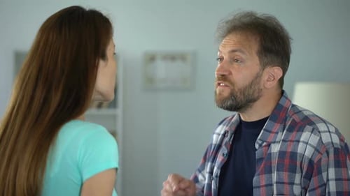 Couple Arguing Violently in Home Setting